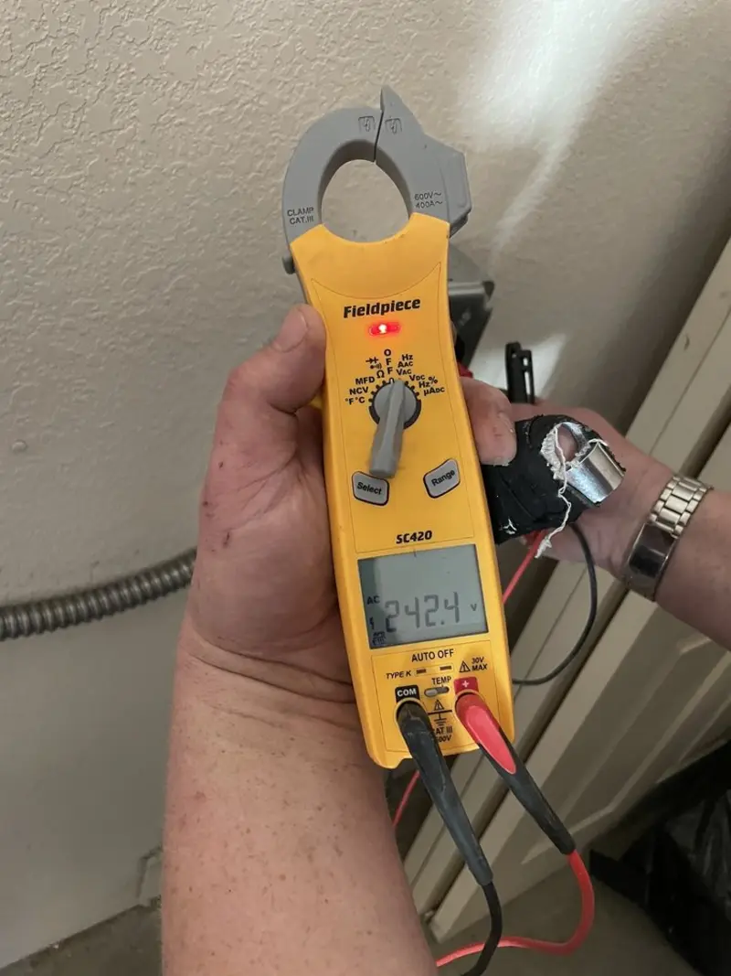 Voltage testing with clamp meter during Recessed Lighting Installation in Shelbyville
